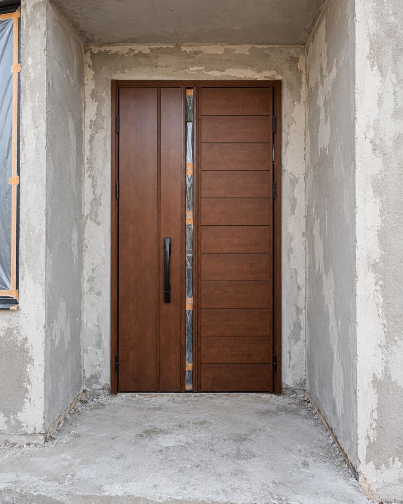 Asymmetric double door with glass slot during installation