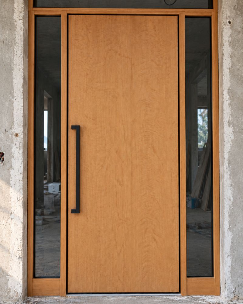 Entrance door in a natural tone during installation